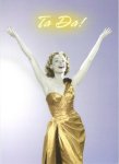 Woman in gold gown raising her arms and saying "ta da!"and saying